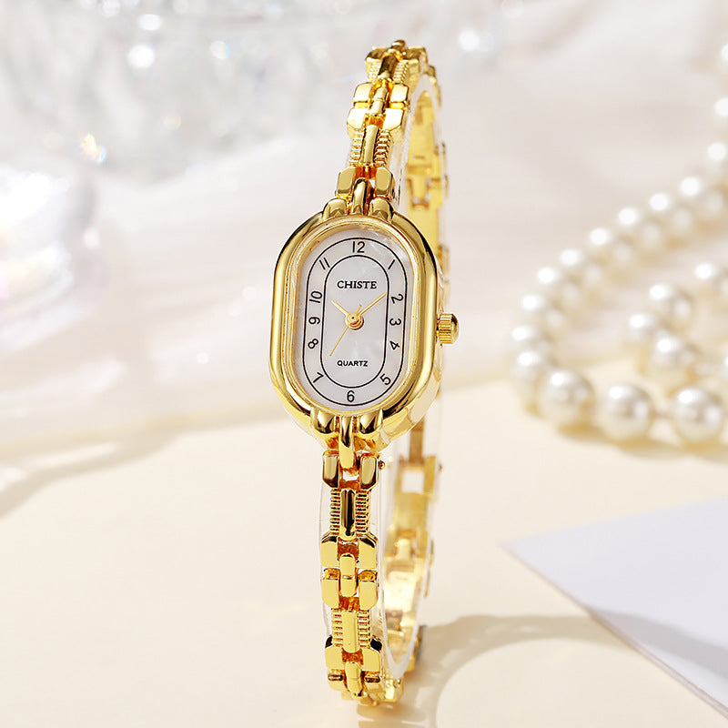 Alira Moment Ur | 18 karat guld