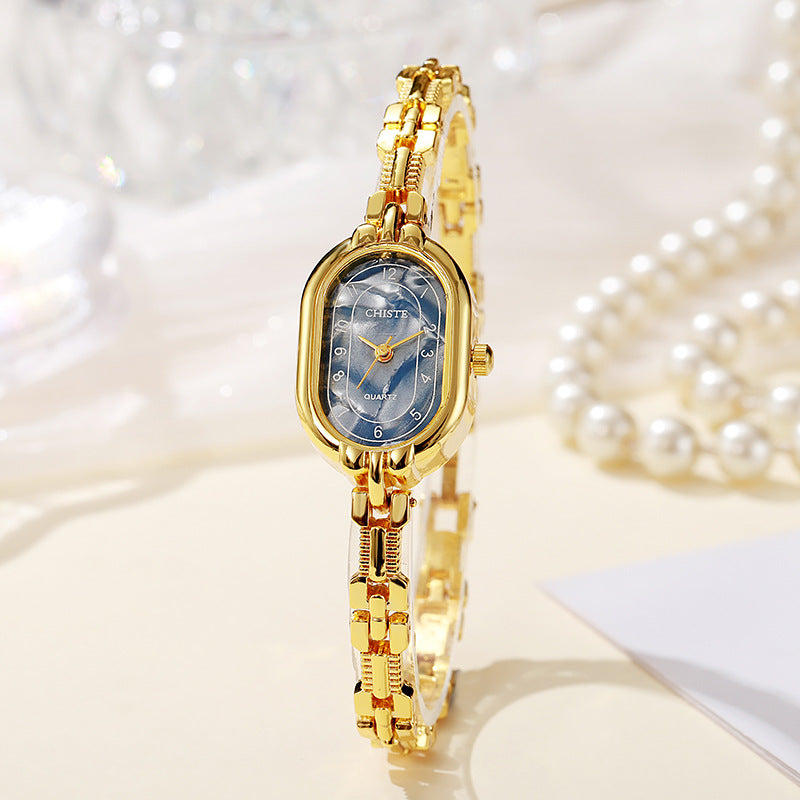 Alira Moment Ur | 18 karat guld